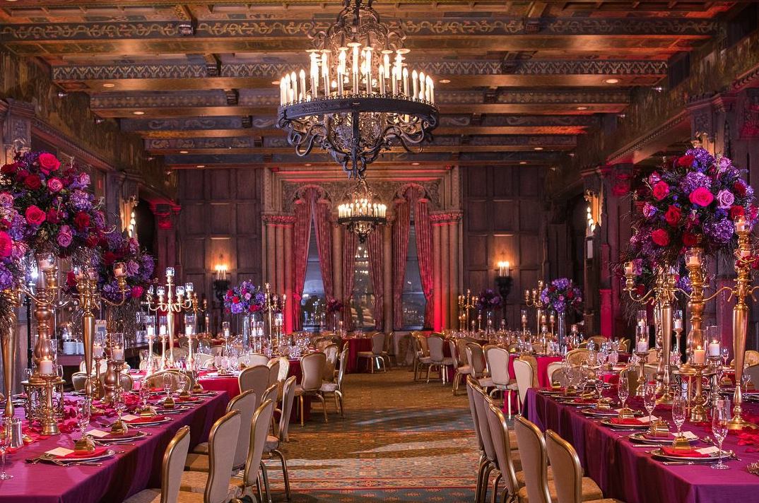 tables with fance place settings and chandelier 