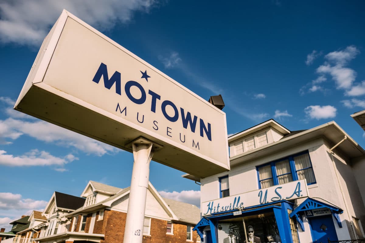 angle shot of motown museum sign with houses in background