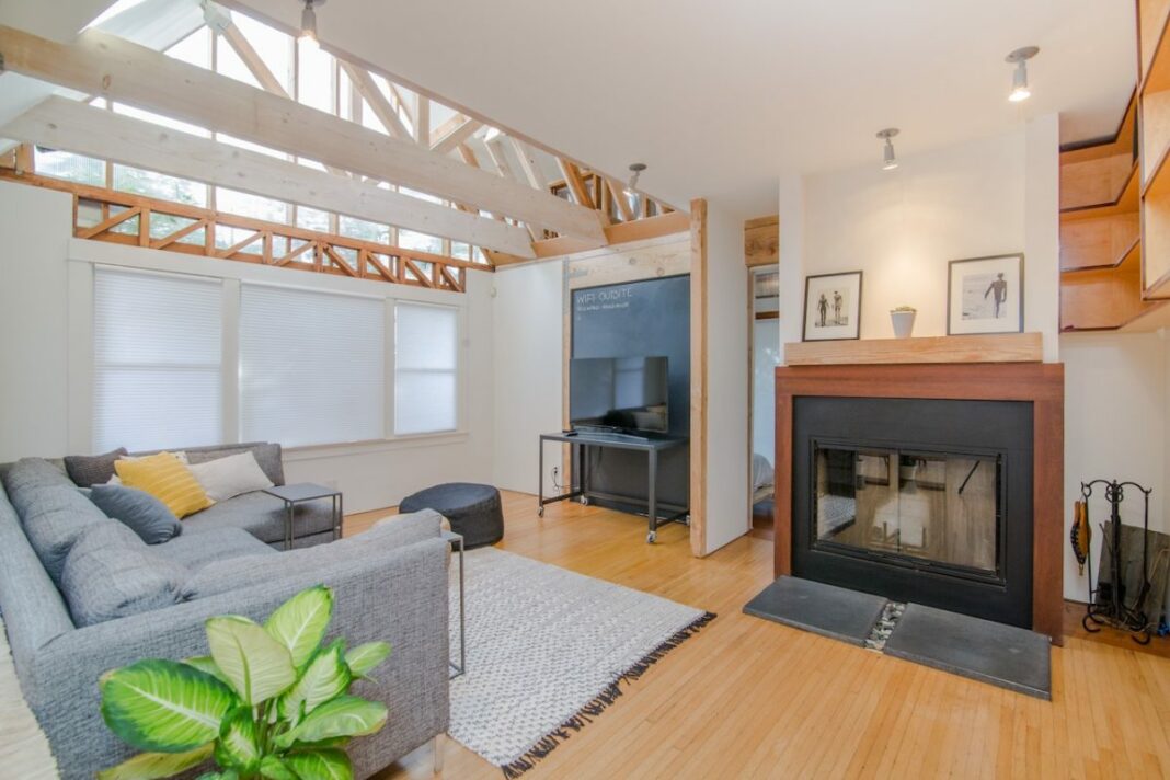 image of modern living room with fireplace, tv, and couch