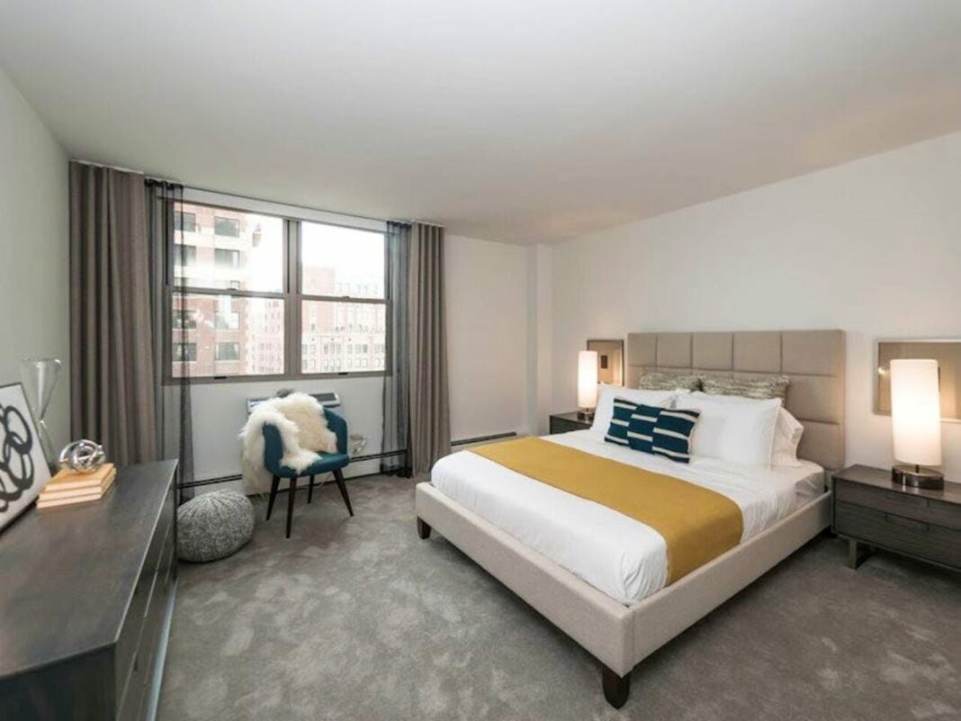 bedroom with bed and large window