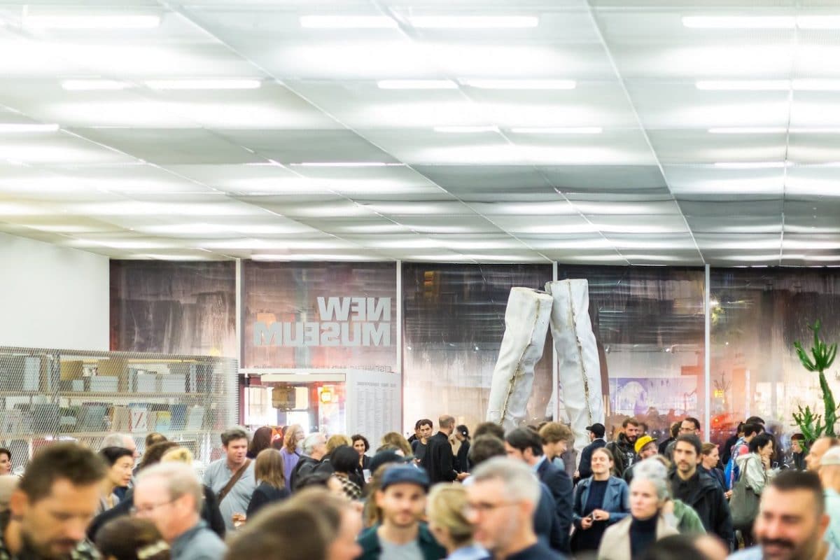 tops of peoples' heads wandering around lobby of new museum on opening day