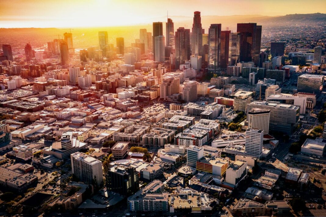 aerial view of los angeles with skyscrapers and sunlight