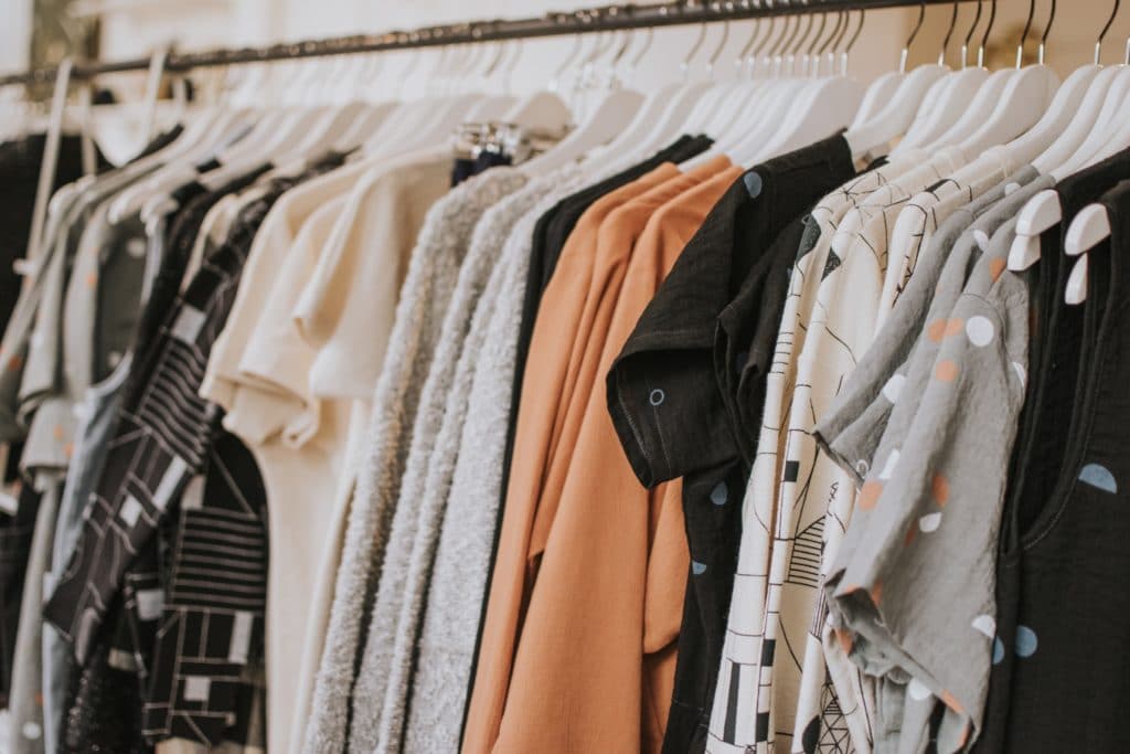 close up on clothes on rack in store