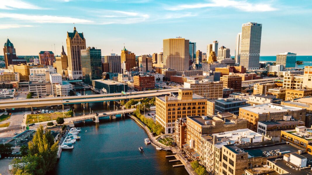 The Milwaukee skyline sits behind the view of the Milwaukee River